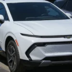 White Chevrolet Equinox EV 2LT, front three-quarter view; the 2027 Chevy Equinox EV keeps this design