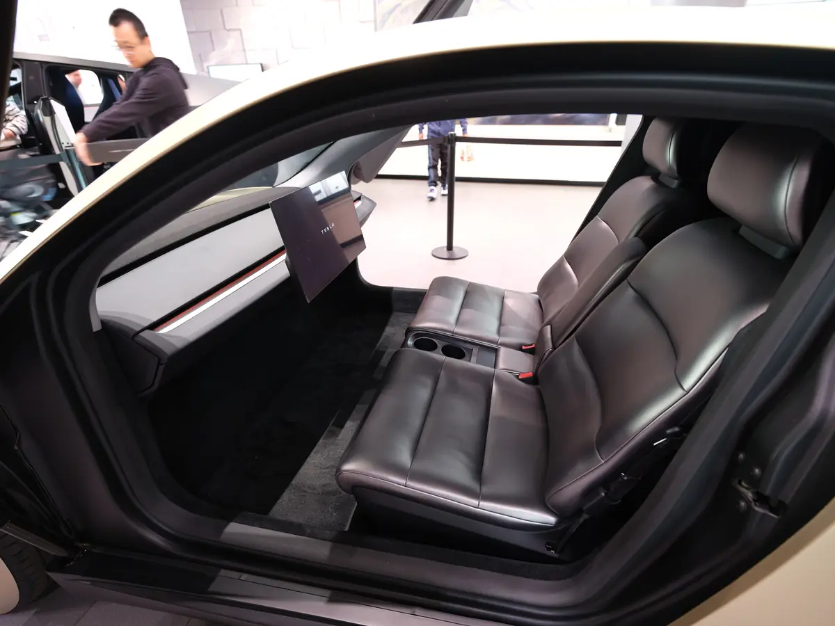 Interior of the Tesla Cybercab showing two seats, a large screen and no steering wheel or pedals