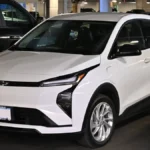 White 2027 Chevrolet Bolt LT in a parking garage, one of the cheapest Tesla alternatives in the US