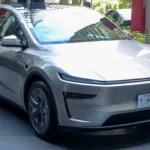 Cosmic Silver Tesla Model Y L Premium AWD on display, the six-seat SUV at the center of Model Y L Zen Grey dashboard complaints