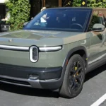 Launch Green Rivian R2 parked outside Rivian's Palo Alto store; current Rivian R2 models ship without LiDAR