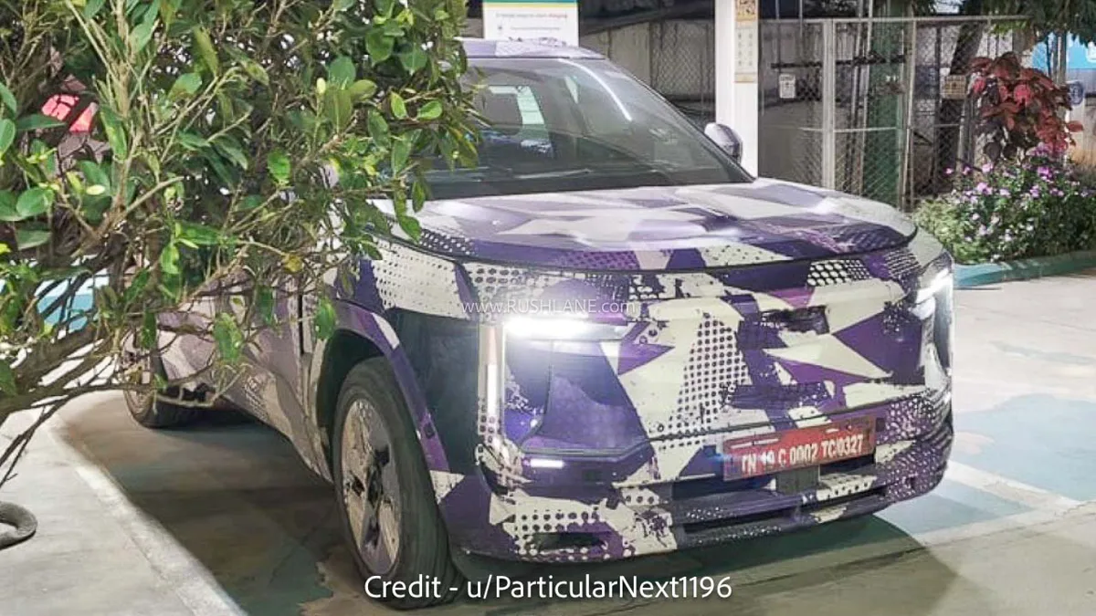 Front view of the camouflaged Mahindra BE 7 prototype showing its C-shaped LED daytime running lights