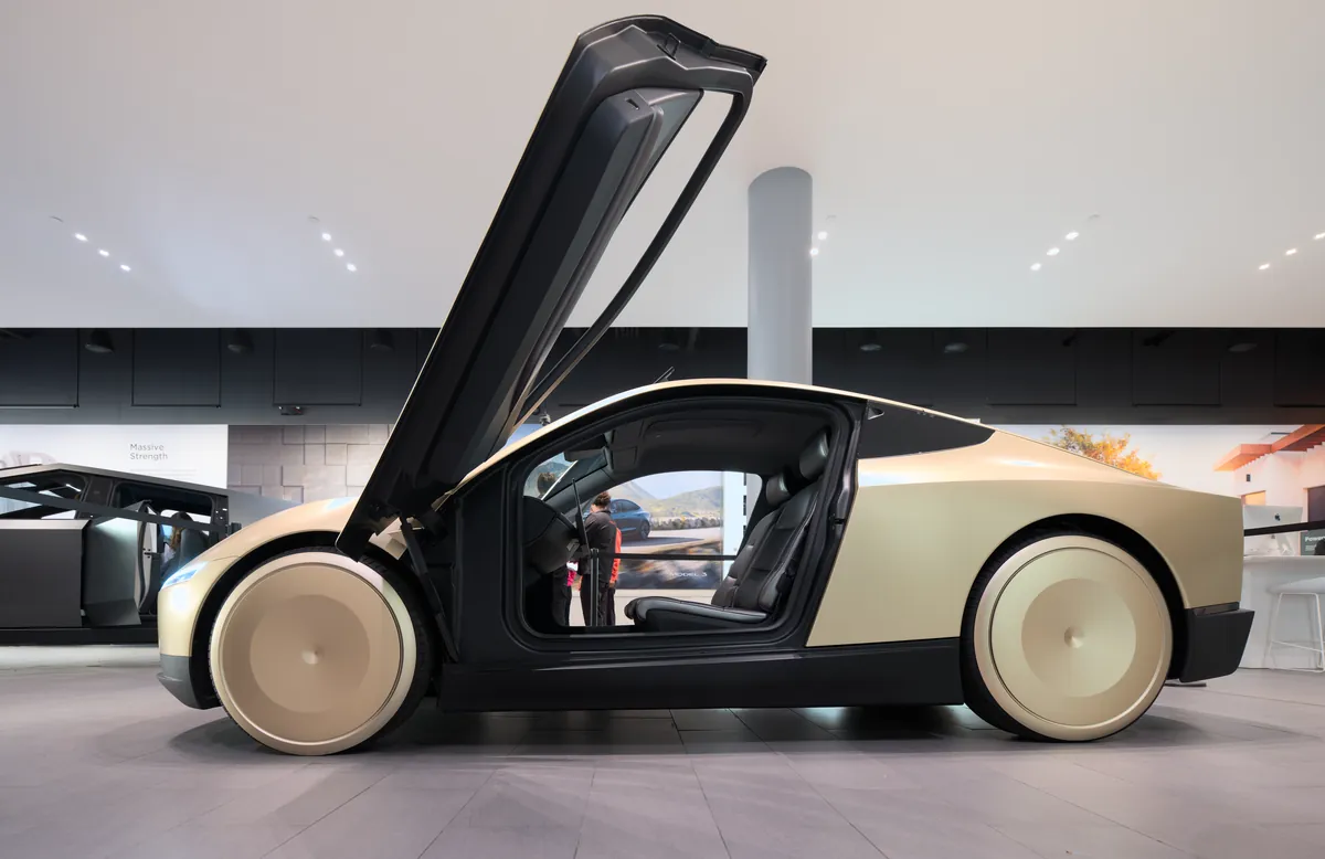 Tesla Cybercab on display, the purpose-built car behind the Tesla Robotaxi app