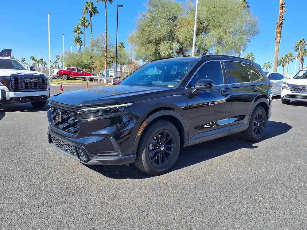 Black 2025 Honda CR-V Hybrid Sport parked on a dealer lot, the model the 2028 Honda CR-V is expected to replace