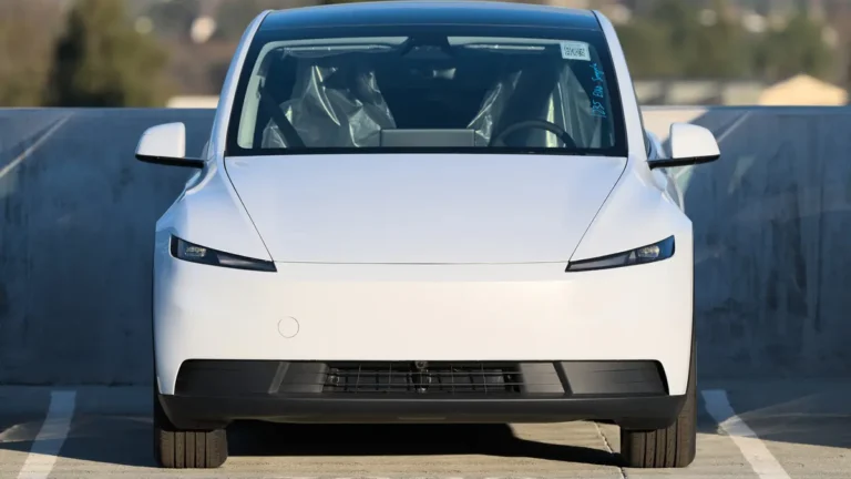 White Tesla Model Y in front view; a smaller Tesla Model 2 compact SUV has been reported but not confirmed